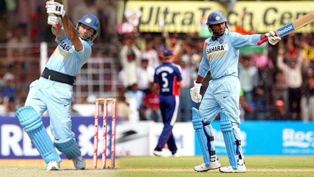 Yuvraj raises his bat and celebrates his ton.